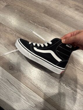 Vans Black and White High-Top Skate Sneakers
